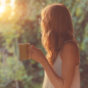 woman holding a coffee cup - Ritual