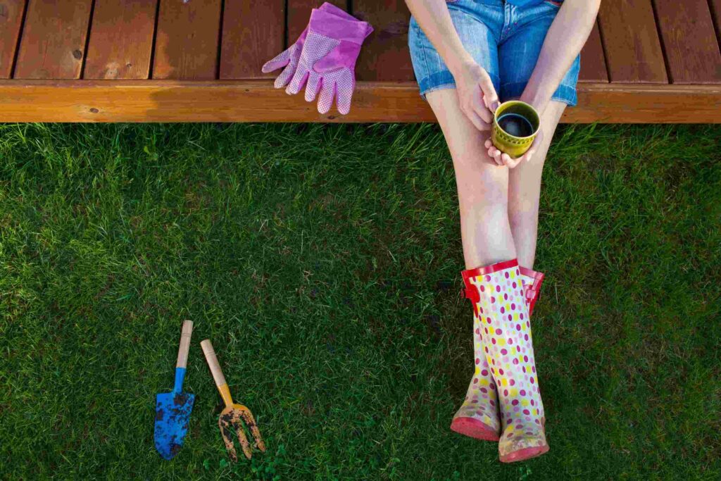 woman resting in garden with gardening tools - MAKE WORK-FROM-HOME, WORK FOR YOU: Protecting What is Sacred