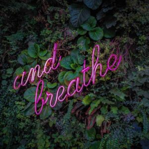 words "and breathe" on plant wall - ‘Why Am I Still Stressed Even Though I Meditate?’